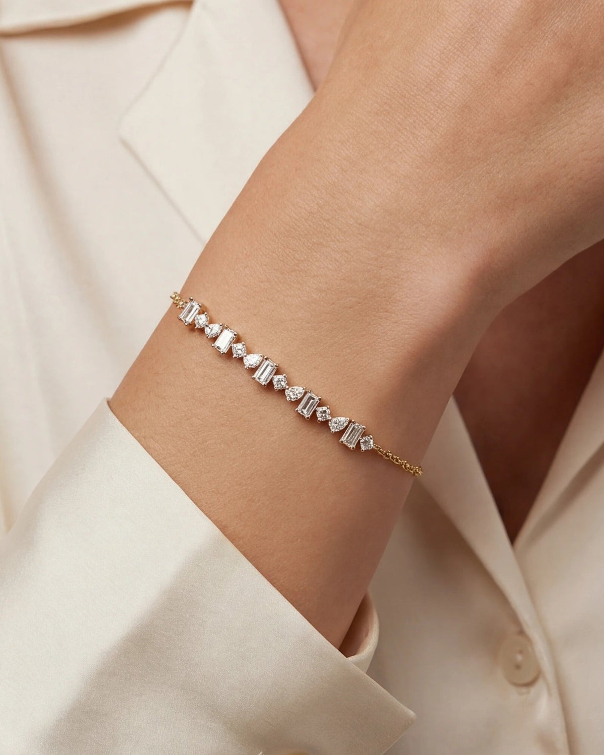 Delicate bracelet on a wrist with a neutral background #color_gold