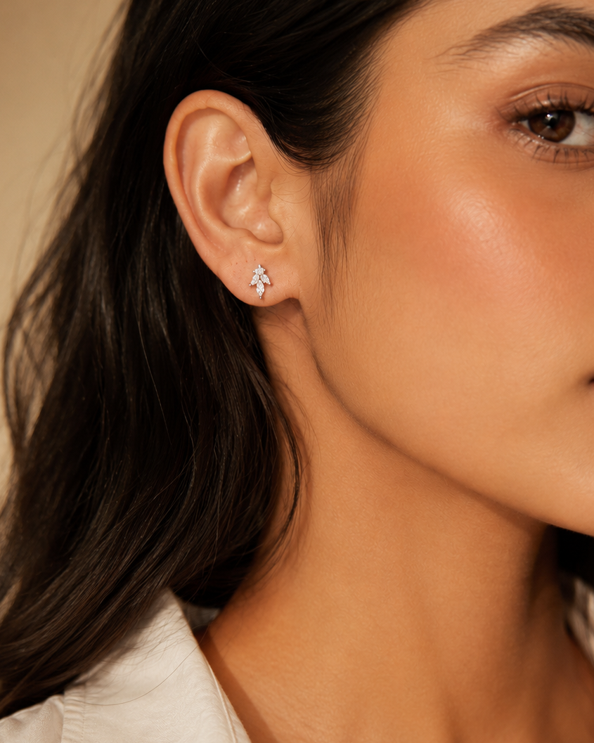 marquise-cut white stone cluster leaf stud earrings #color_silver