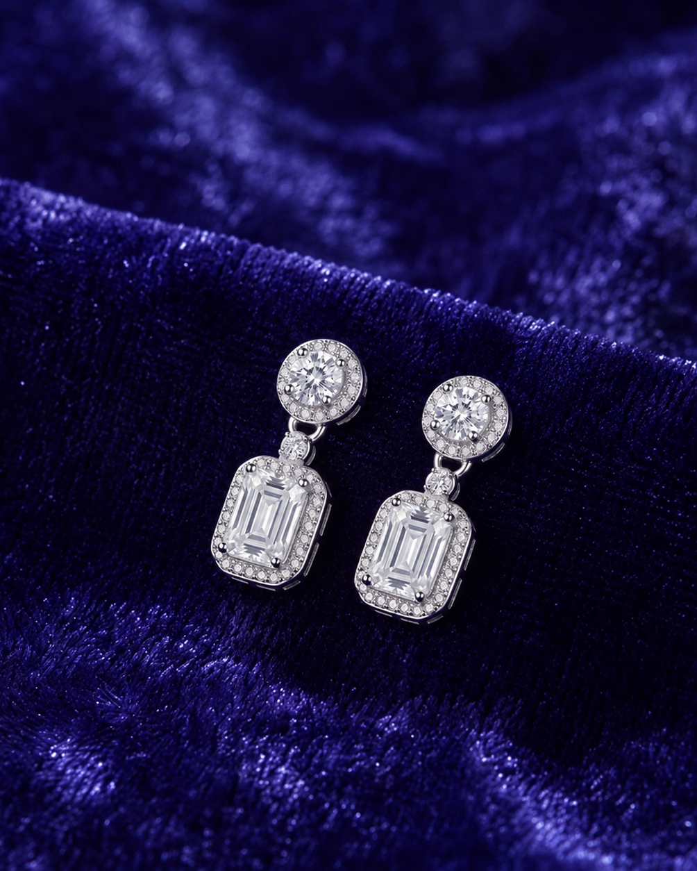 Pair of diamond earrings on a white background #color_silver