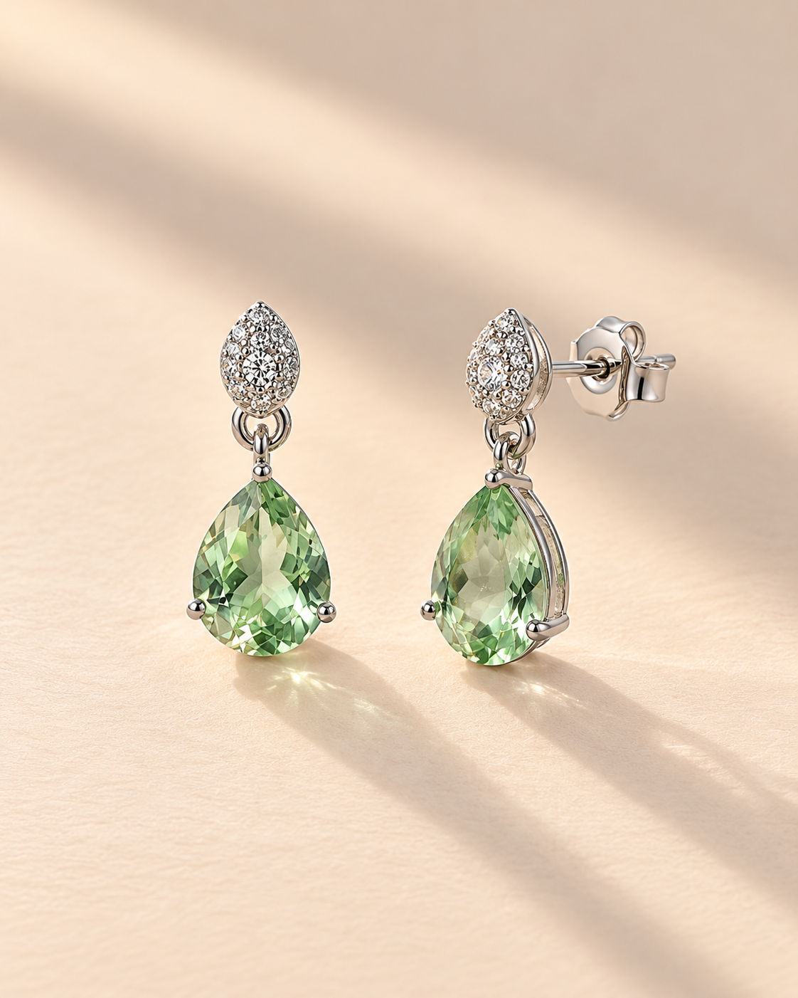 green pear-cut drop earrings with white pavé top #color_silver