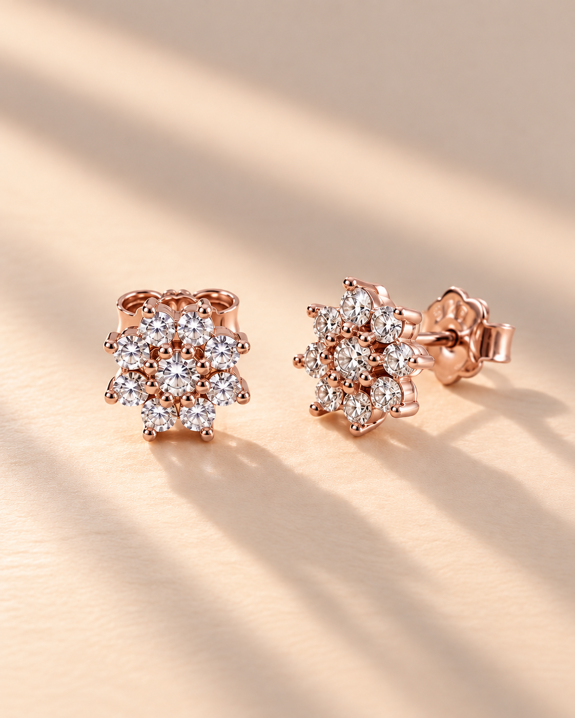 Snowflake cluster stud earrings with brilliant white accents #color_rose gold