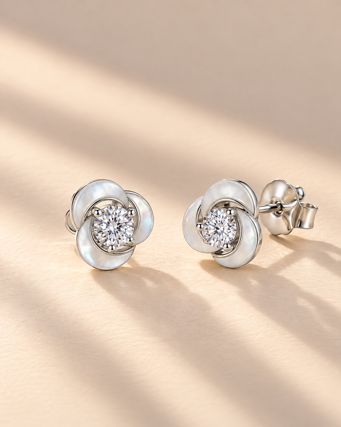 Celeste Swirl Stud Earrings #color_silver