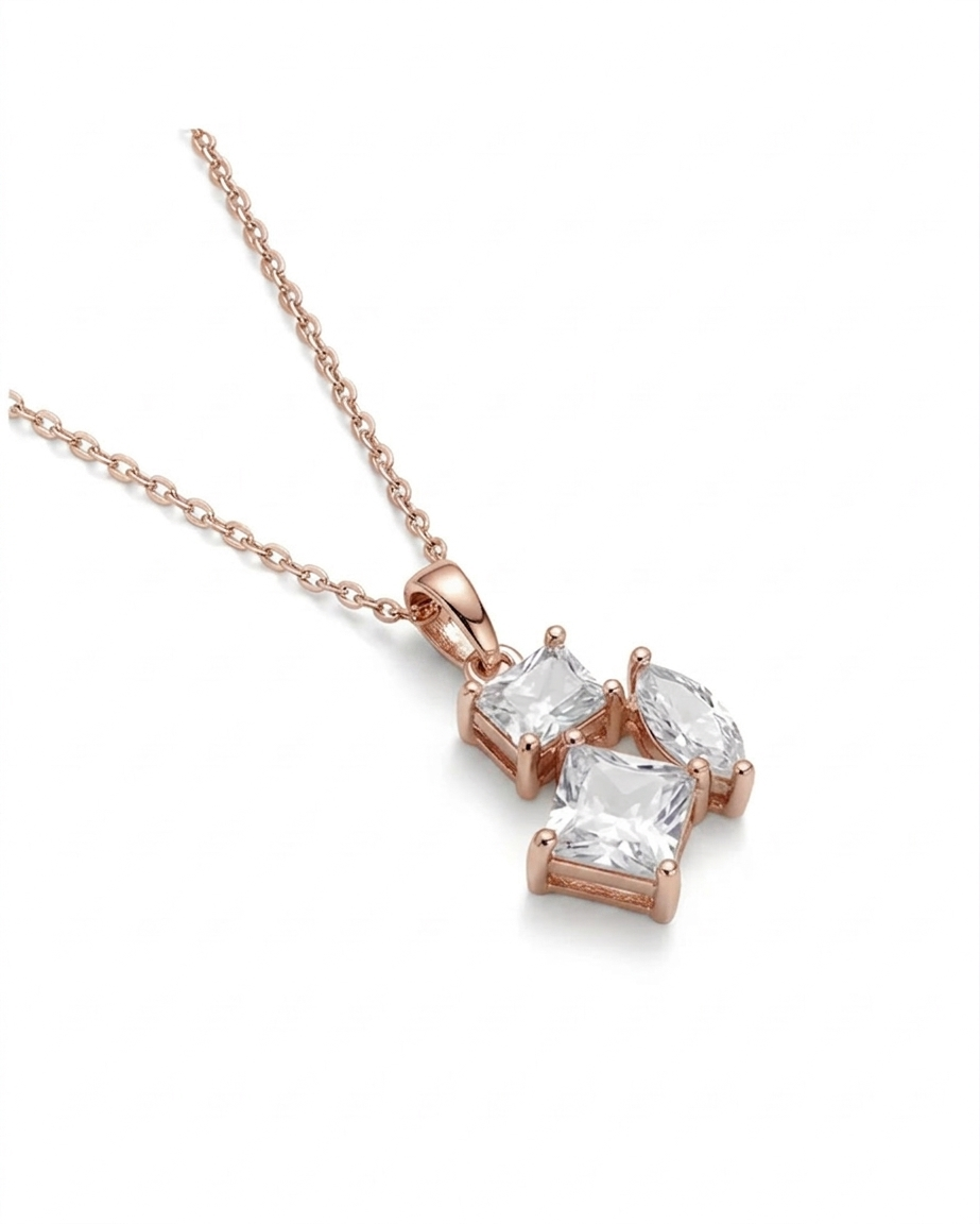 Rose gold necklace with a three-stone diamond pendant on a white background #color_rose gold