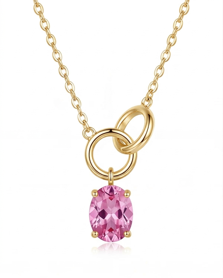 Gold necklace with a pink gemstone pendant on a white background #color_gold