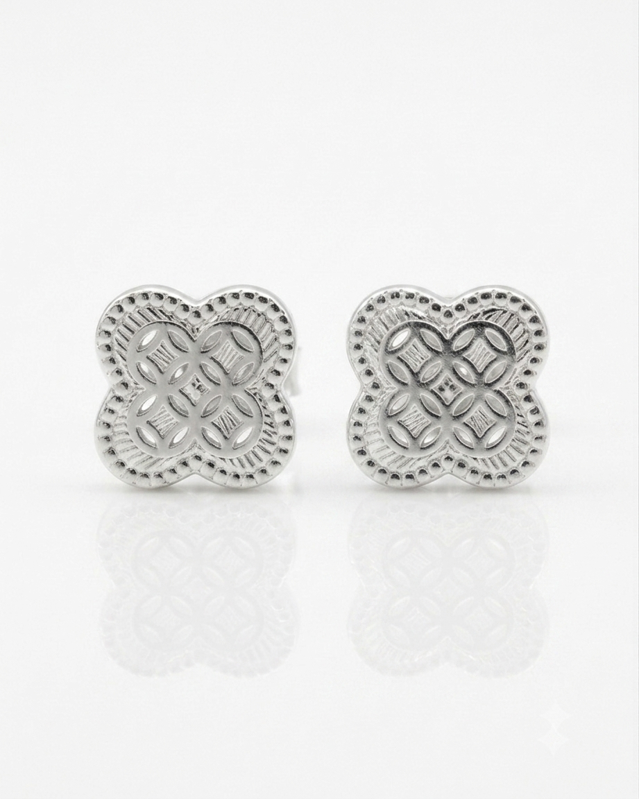 Pair of silver floral earrings on a white background #color_silver