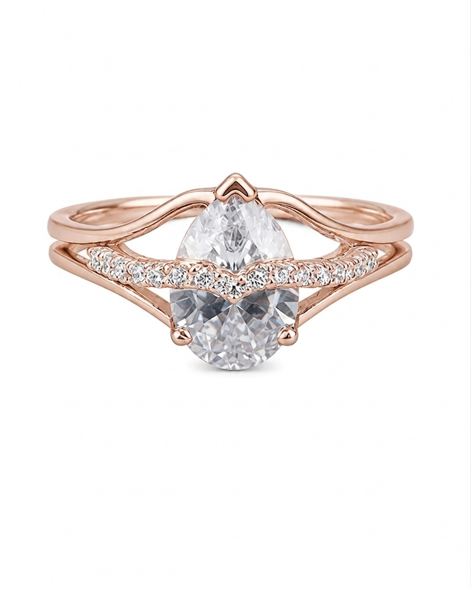 Rose gold ring with a pear-shaped diamond on a white background #color_rose gold