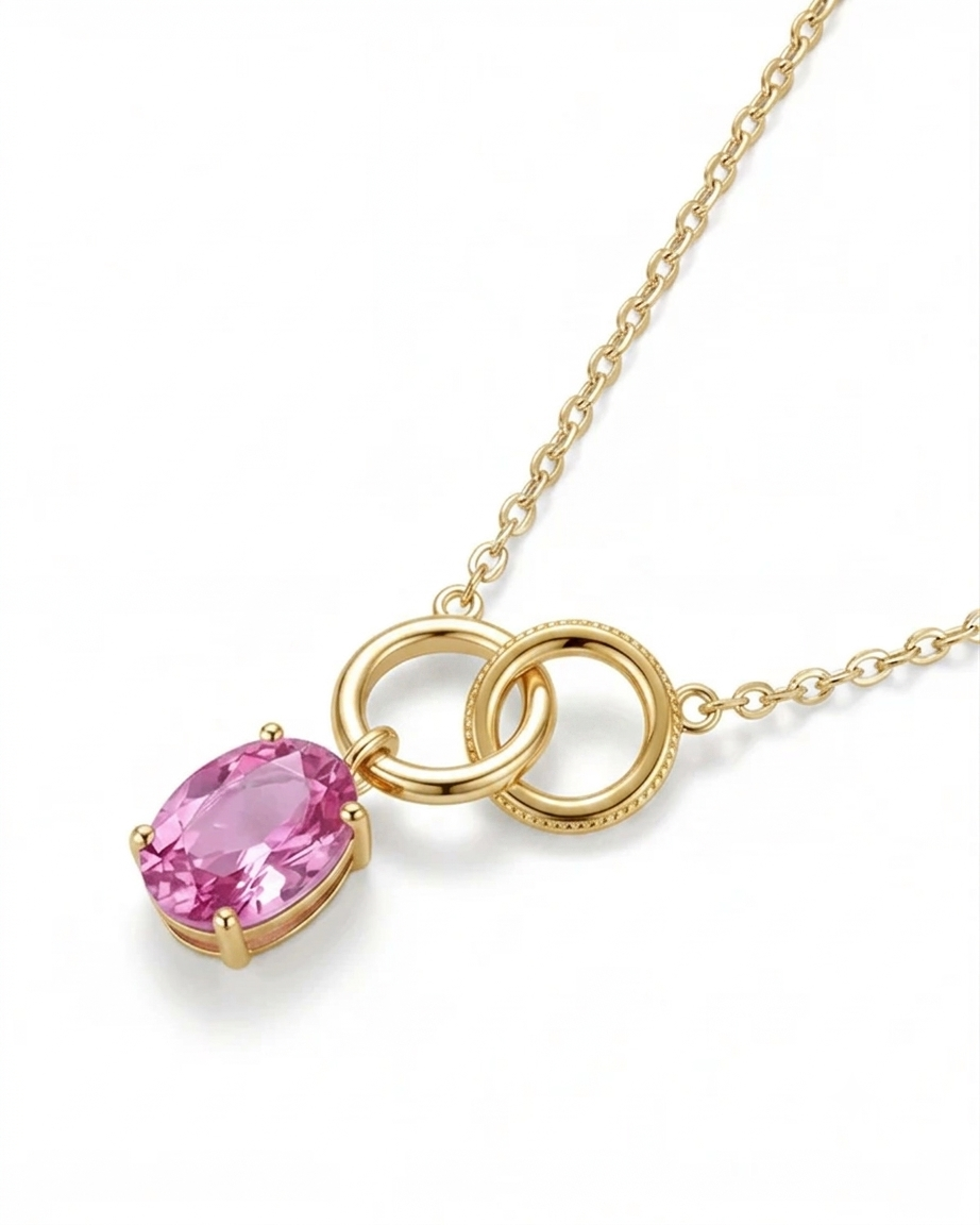Gold necklace with a pink gemstone pendant on a white background #color_gold
