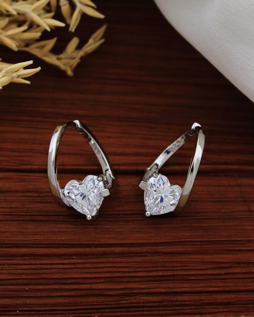 Pair of 925 Sterling Silver heart charm huggie hoop earrings.