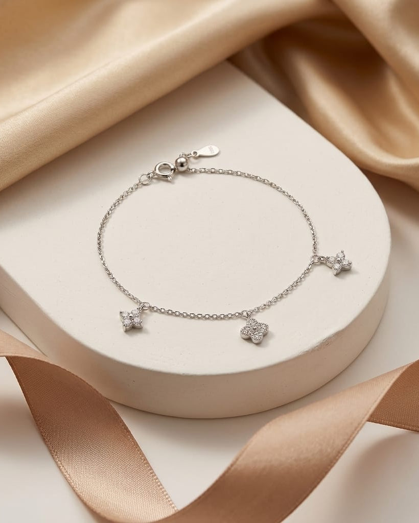 925 Sterling Silver pavé clover charm bracelet with fine cable chain.