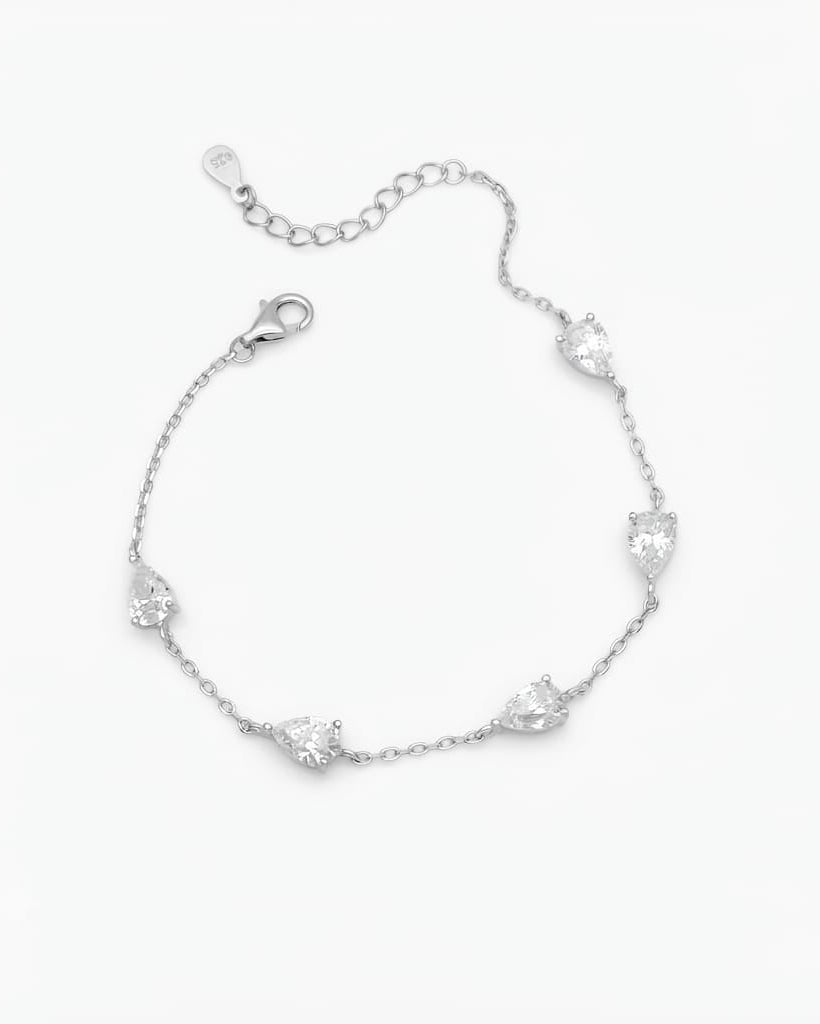 925 Sterling Silver pear-cut station chain bracelet with adjustable lobster clasp.