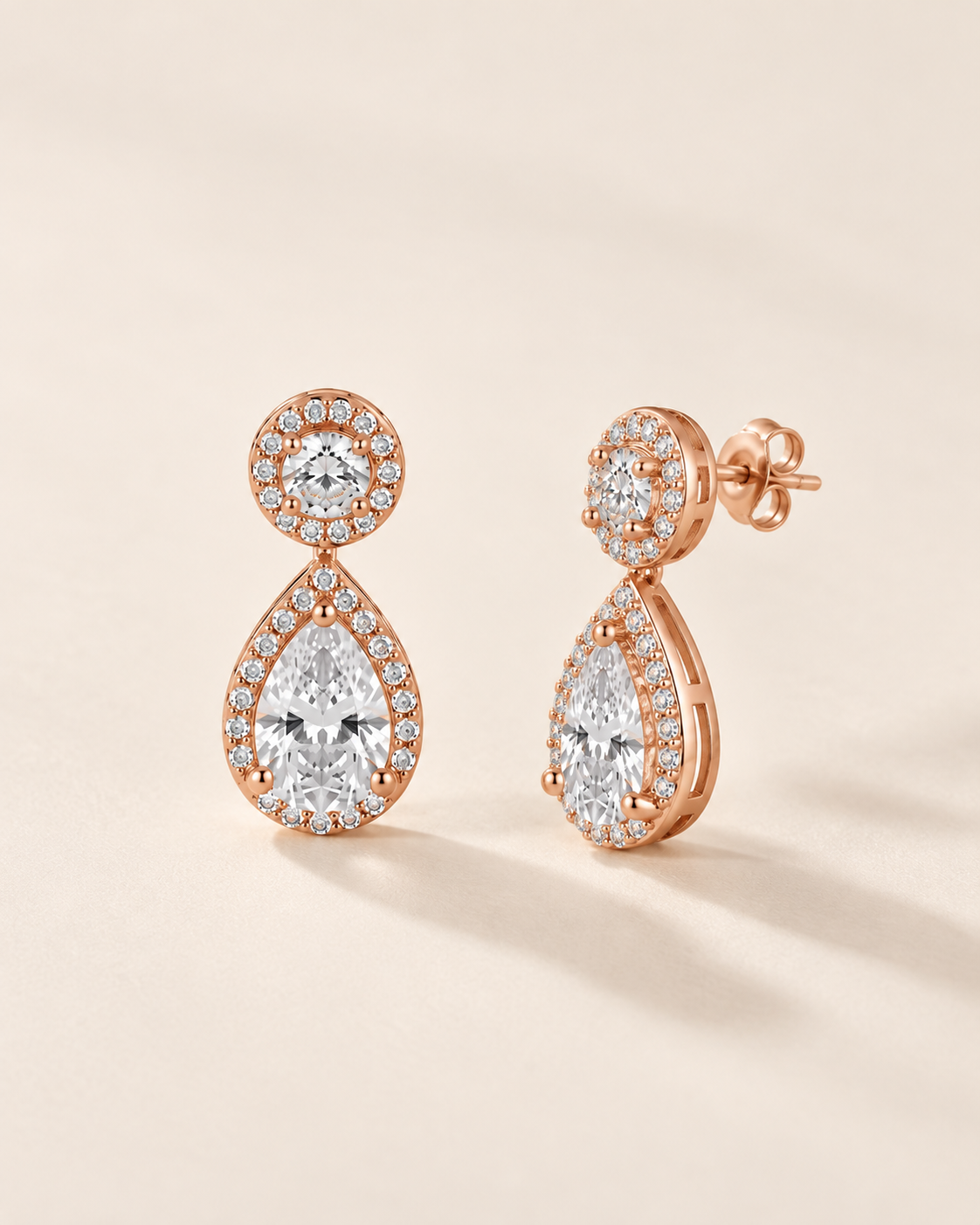 925 Sterling Silver pear halo drop earrings with signature finish #color_rose gold