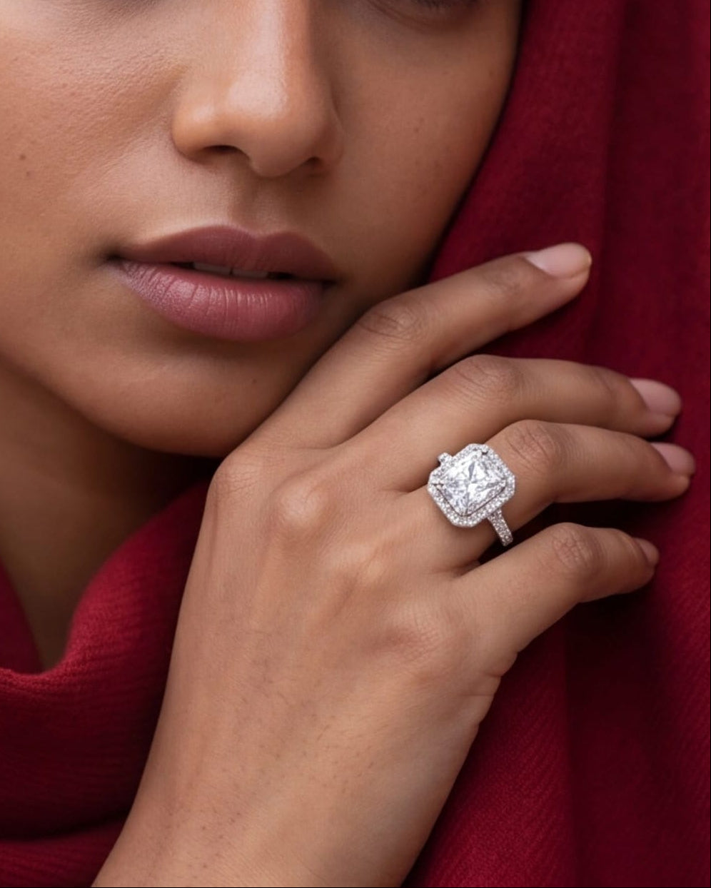 Woman wearing a diamond ring with a red scarf #color_silver