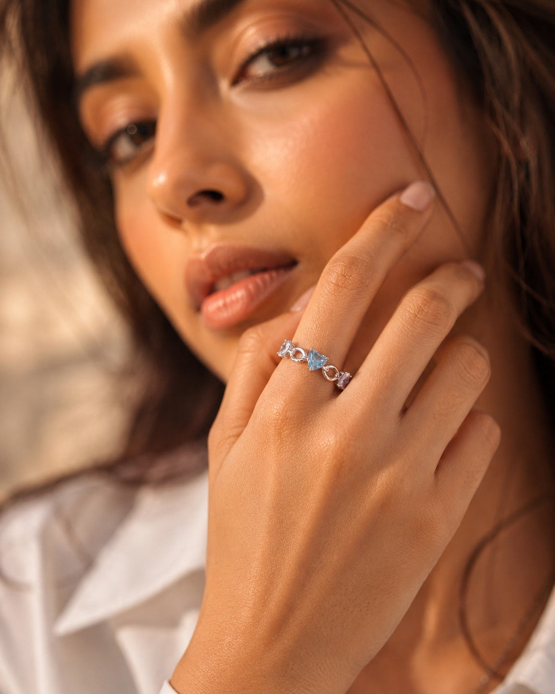 925 Sterling Silver heart link open ring with blue and white accents.