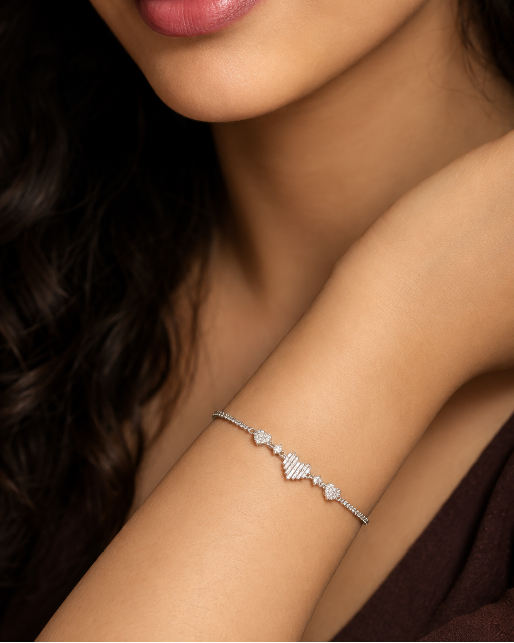 bracelet with pavé hearts and baguette-cut center design #color_silver