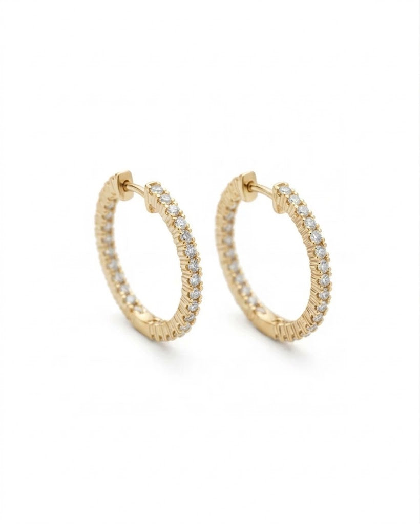 Gold hoop earrings with embedded stones on a white background #color_gold