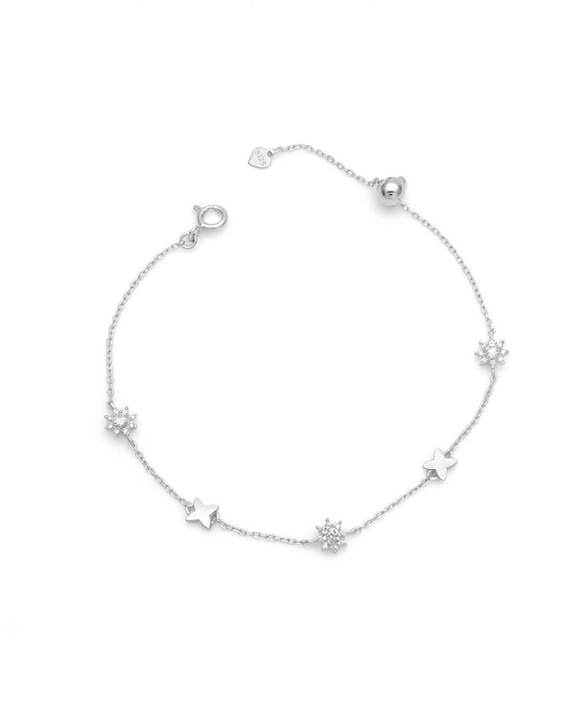 925 Sterling Silver celestial star station bracelet with polished and pavé charms.