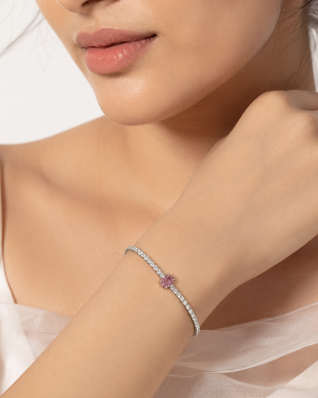 Pink solitaire tennis bracelet