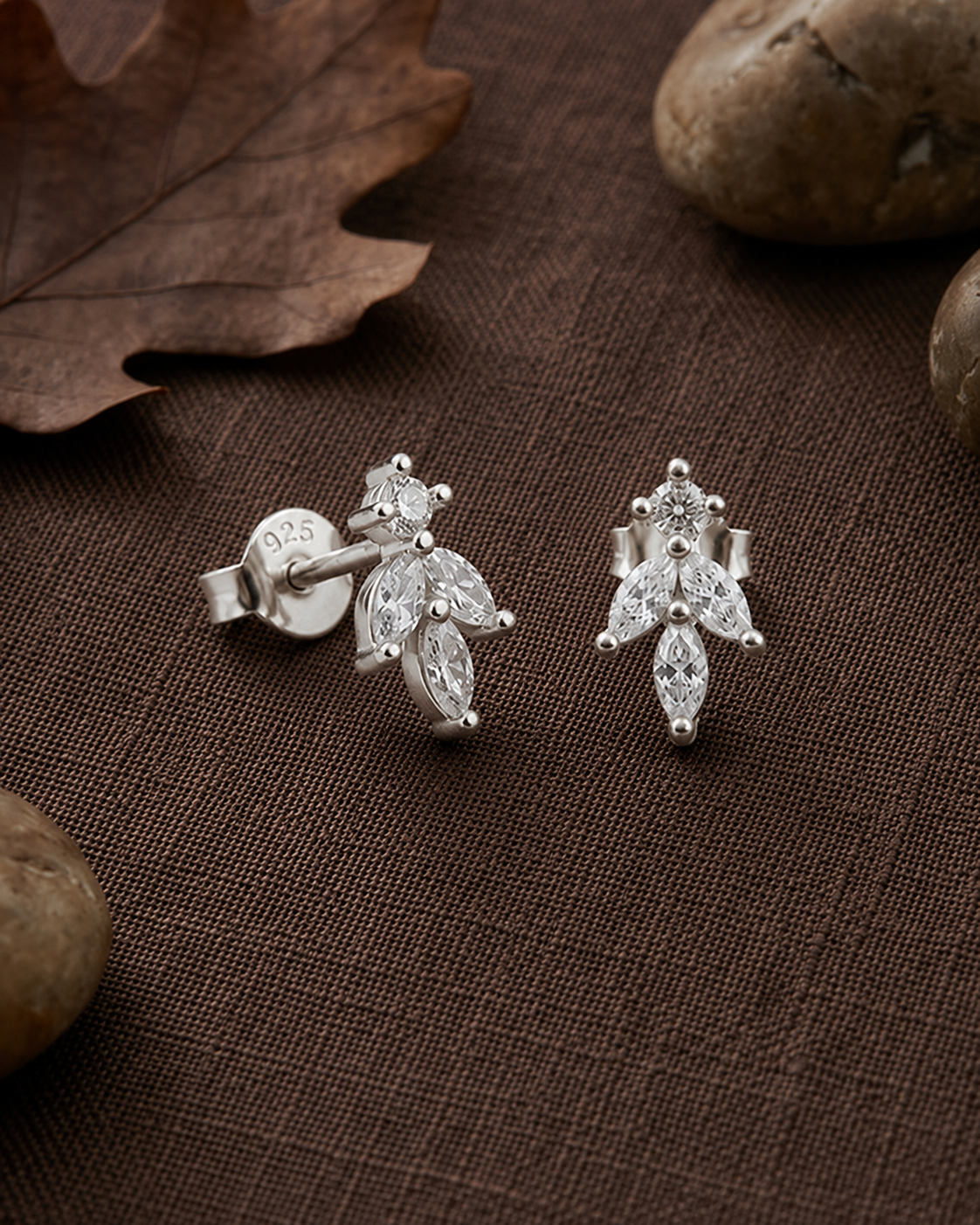 marquise-cut white stone cluster leaf stud earrings #color_silver