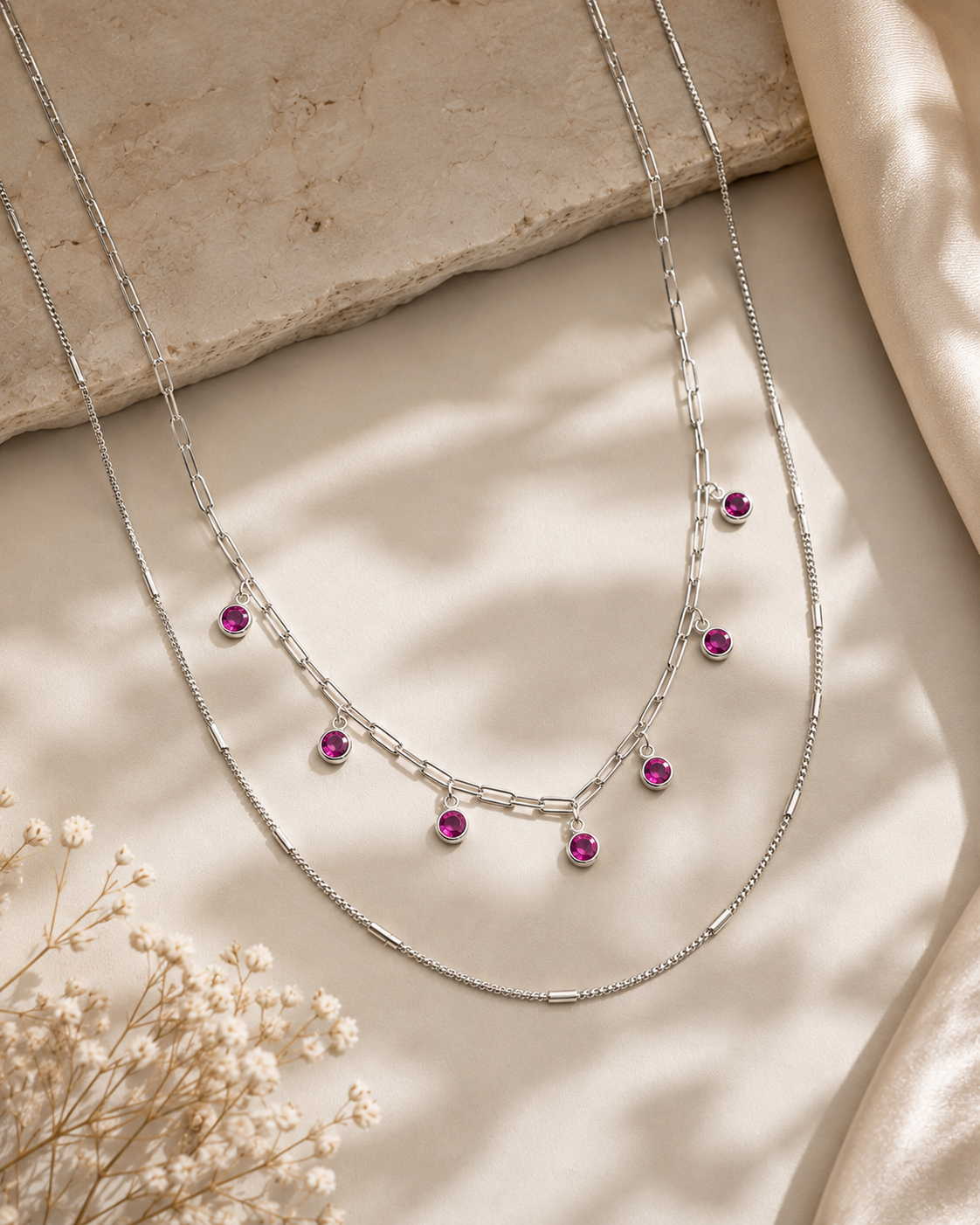 layered necklace with elongated link chain and pink accents #color_silver