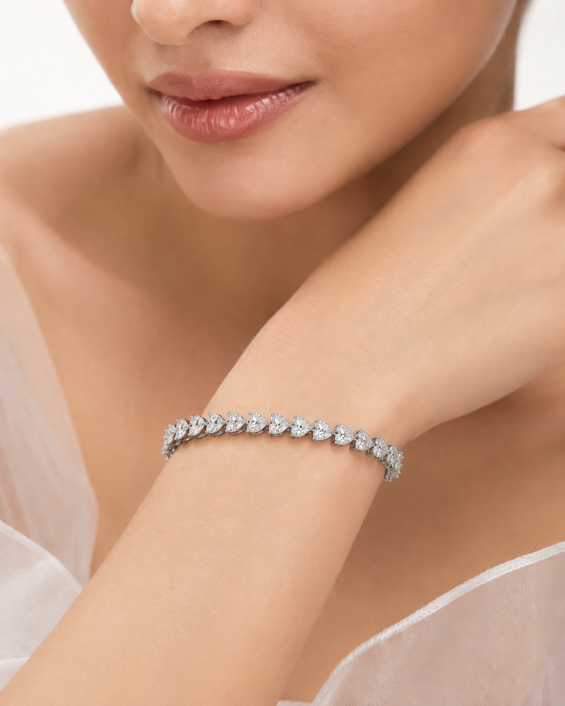 Close-up of a diamond bracelet on a woman's wrist with a soft background