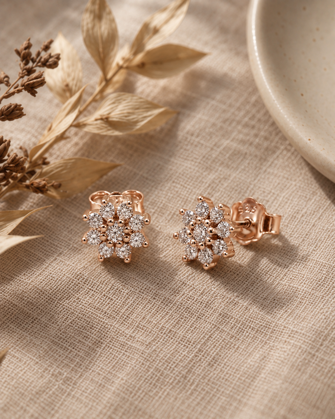 snowflake cluster stud earrings with brilliant white accents #color_rose gold 