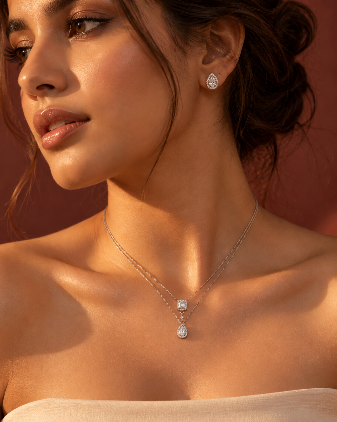 Teardrop pendant necklace and matching earrings with sparkling white accents