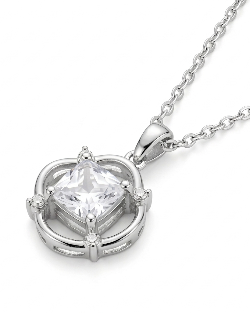 Heart-shaped diamond pendant on a silver chain against a white background #color_silver