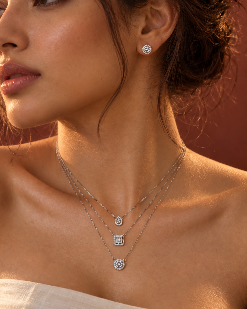 Geometric layered necklace and earrings set with sparkling white accents