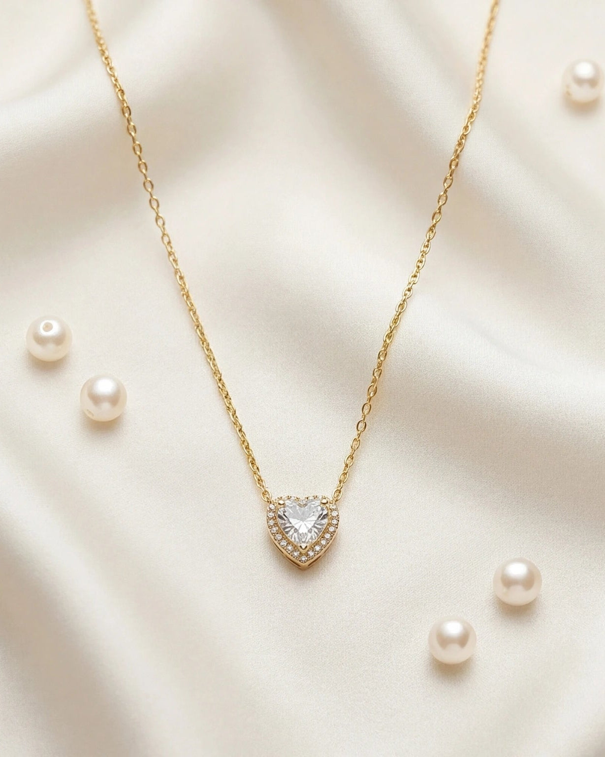 Elegant heart-shaped CZ halo pendant necklace #color_gold