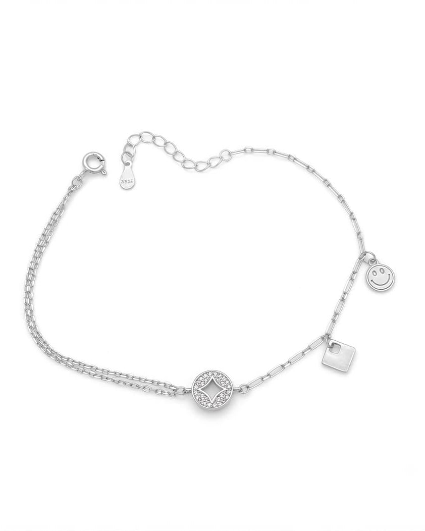 925 Sterling Silver playful charm bracelet with circle, square, and smiley charms.