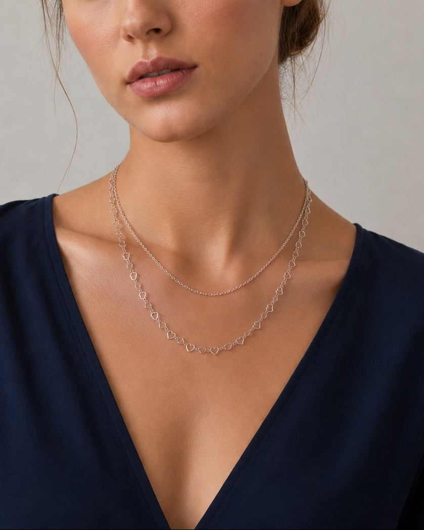 Layered silver necklace with double heart pendants #color_silver