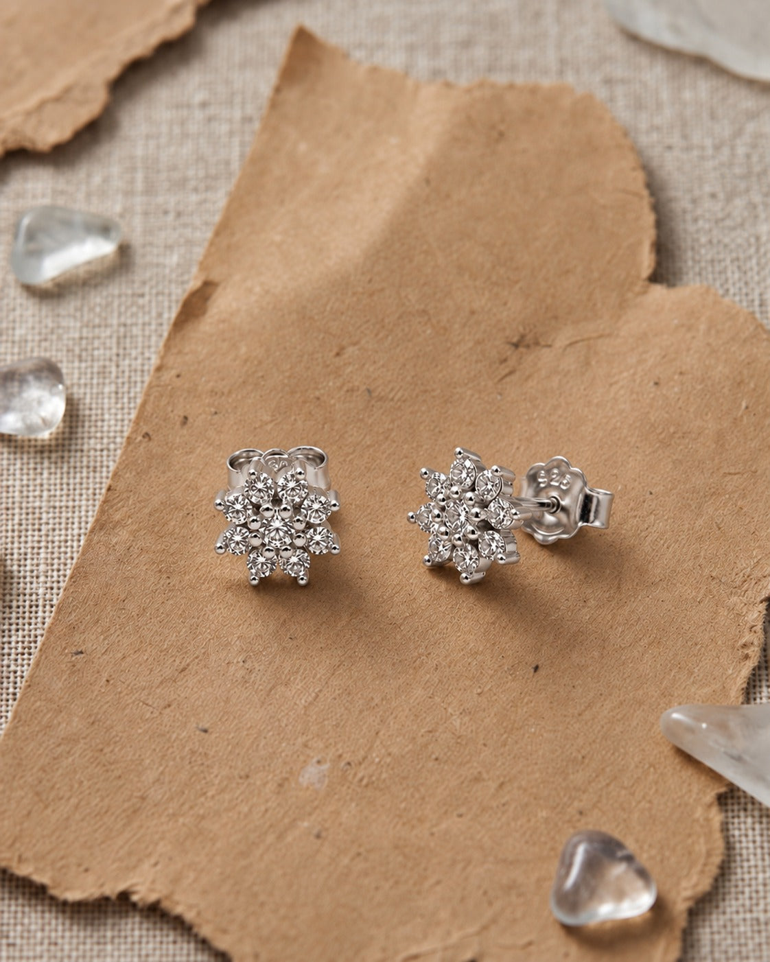snowflake cluster stud earrings with brilliant white accents #color_silver